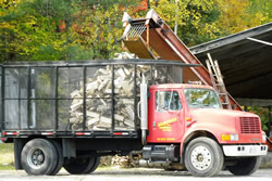 Gilpatrick & Sons loading firewood for delivery.